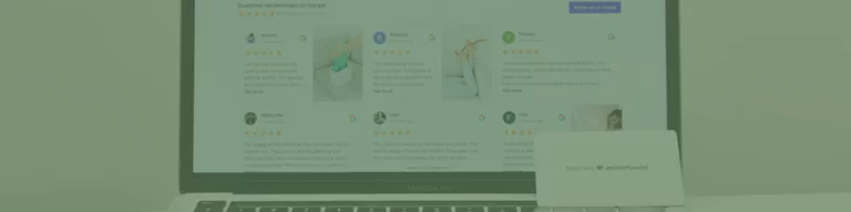 A laptop showcases a webpage filled with customer reviews and star ratings, hinting at expert Melbourne web design. In front, a closed business card holder labeled whiteboard adds a touch of professionalism.